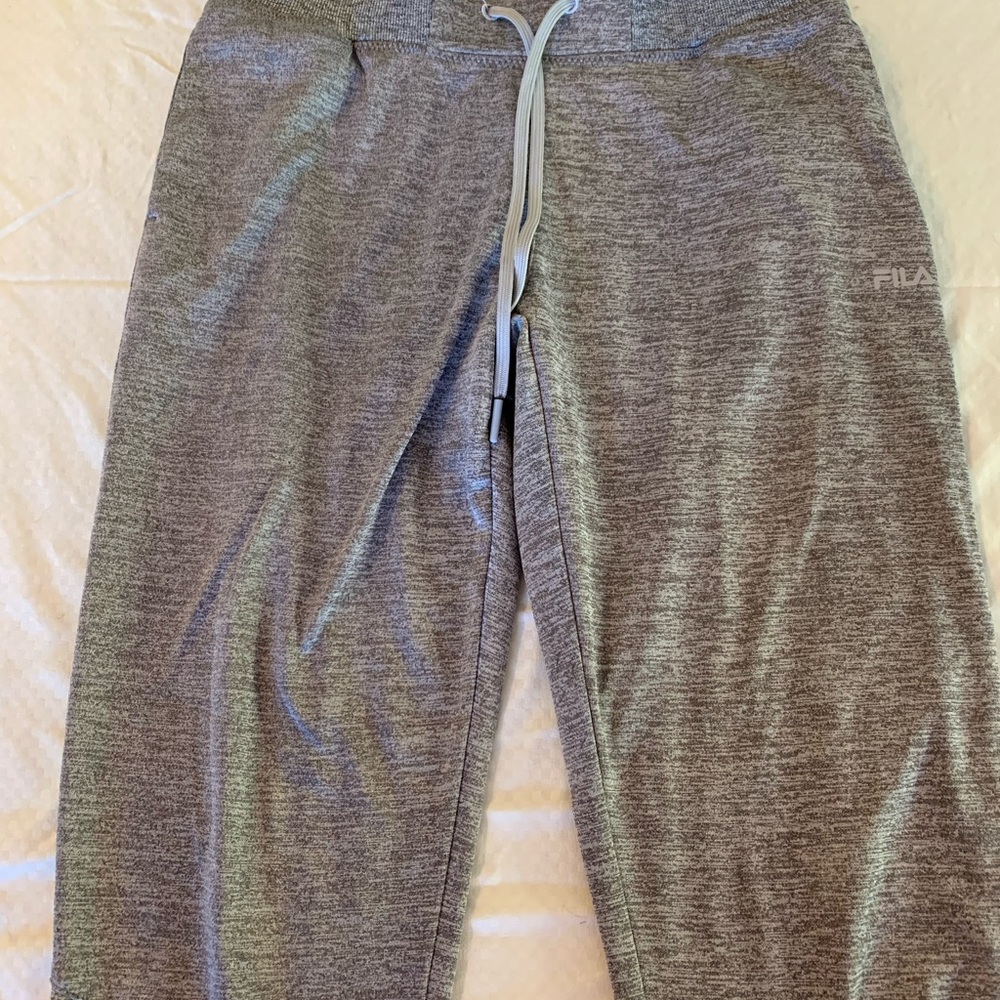 Small athletic sweatpants, gray color, FILA brand.